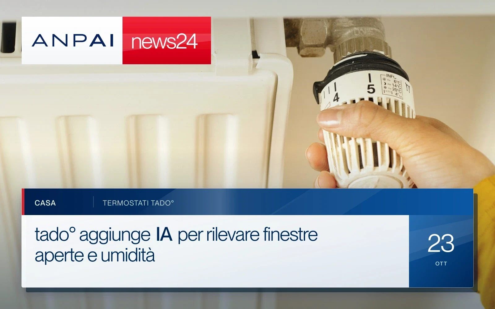 Una mano regola la valvola di un radiatore domestico